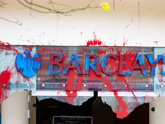 All the windows of the Barclays Bank branch in the centre of Bristol have been smashed and graffiti sprayed over them in a co-ordinated attack by a group targeting the bank. 