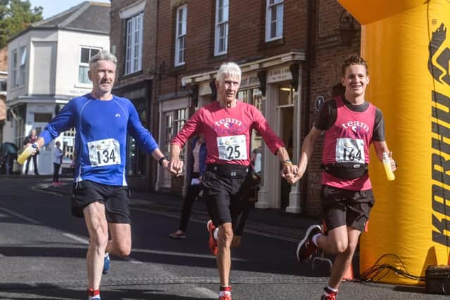 Epworth grandad Vic Shirley completing the he Anna Verrco half marathon with his son John and grandson Bryce.